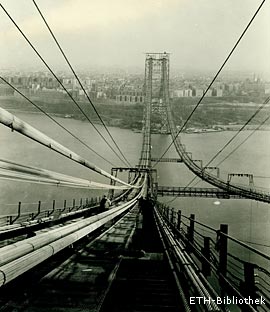 Mitbauen am Mythos Amerika. Der ETH-Absolvent Othmar H. Ammann ging 1904 nach New York und konstruierte Hängebrücken, z. B. ab 1927 die berühmte George Washington Bridge über den Hudson River in Manhattan. Ansicht des bereits fertig gestellten Fussgängerwegs von 1929.